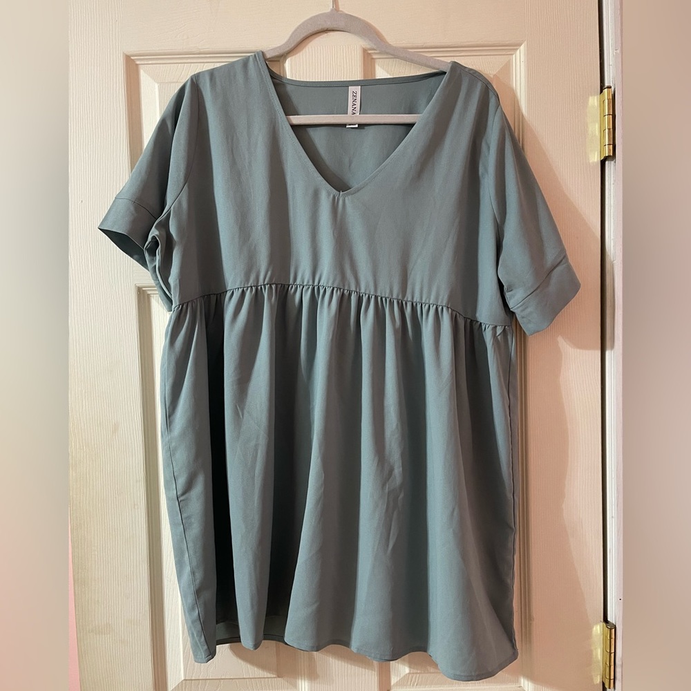 Woman’s Teal Blouse
